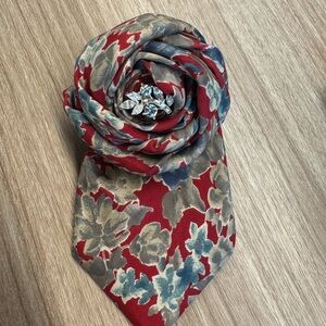 Reimagined necktie Brooch with Vintage Jewelry embellishment.